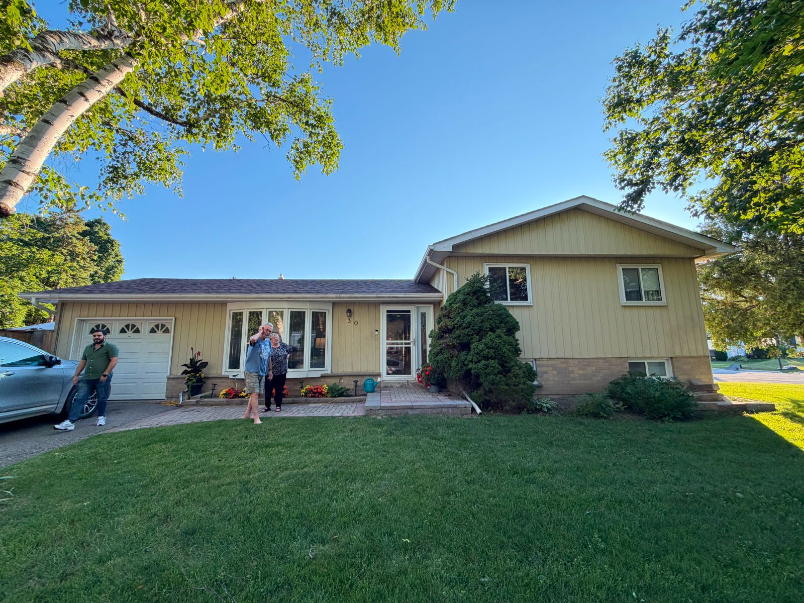 Exterior house painting before photo — faded yellow siding, GTA