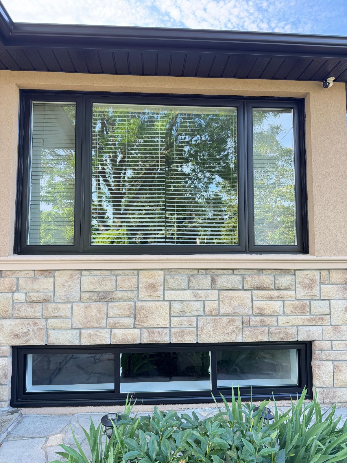 Bay window and stone detail after exterior repaint, GTA