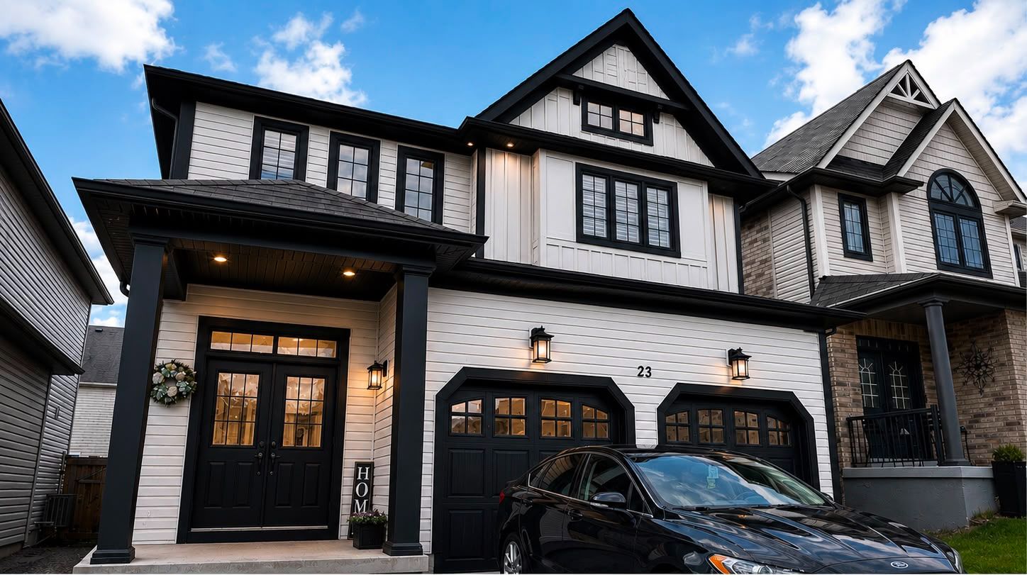 Exterior painting after photo — crisp white siding with black trim, GTA
